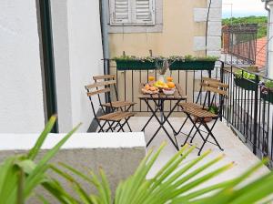 Balkón nebo terasa v ubytování Apartment D & Studio L