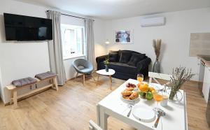 Posezení v ubytování Apartment D & Studio L