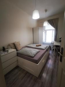 Posteľ alebo postele v izbe v ubytovaní Malasits Art Home