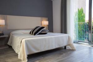 Posteľ alebo postele v izbe v ubytovaní Palazzo Ducale Suites