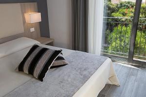 Posteľ alebo postele v izbe v ubytovaní Palazzo Ducale Suites