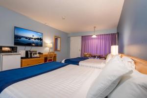 Postel nebo postele na pokoji v ubytování Ocean Crest Motel