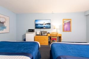 Postel nebo postele na pokoji v ubytování Ocean Crest Motel