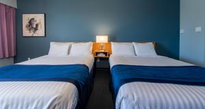 Postel nebo postele na pokoji v ubytování Ocean Crest Motel
