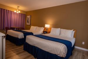 Postel nebo postele na pokoji v ubytování Ocean Crest Motel
