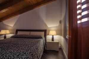 Posteľ alebo postele v izbe v ubytovaní Palazzo Ducale Suites