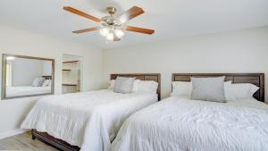 a bedroom with two beds and a ceiling fan at Excellent location,Relax in the heart of the City!! by Kivoya in Phoenix