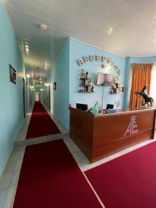 a hotel lobby with a red carpet and a reception desk at ALEM Hotel in Yerevan