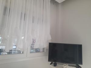 A television and/or entertainment centre at Annas seaside apartment