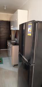 uma cozinha com um frigorífico de aço inoxidável em em Studio apartment, Aqua View Resort, North coast em El Alamein