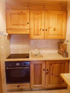 Η κουζίνα ή μικρή κουζίνα στο Superbe appartement au centre de la station