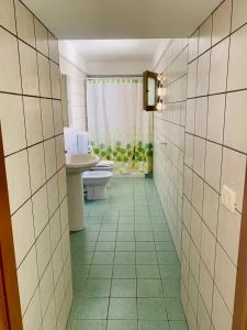 a bathroom with a toilet and a sink at Nonna Annunziata, Casa tipica Salentina vicino le spiagge in Gemini +117 photos