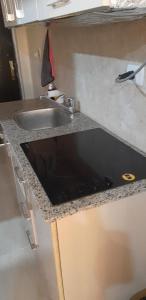 a kitchen counter top with a sink and a sink at Studio apartment, Aqua View Resort, North coast in El Alamein