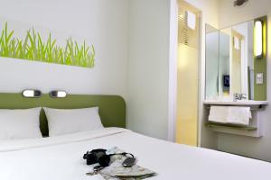 Postel nebo postele na pokoji v ubytování Ibis Budget Montelimar
