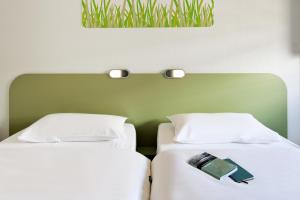 Postel nebo postele na pokoji v ubytování Ibis Budget Montelimar