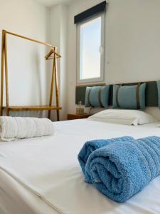 Postel nebo postele na pokoji v ubytování Tzavelitiko Home