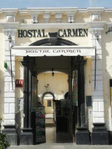 a building with a hospital center sign on the front at Hostal Carmen in Arequipa
