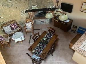 an overhead view of a living room with a table and chairs at Casale Chiara & Giulia in Santa Caterina Dello Ionio Marina