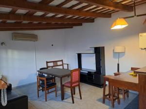 a kitchen and dining room with a table and chairs at BELLO SAN LUIS in San Luis