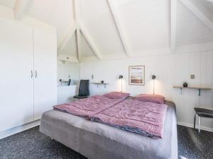 A bed or beds in a room at Holiday home Vejers Strand XX