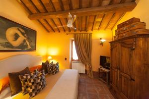 Postel nebo postele na pokoji v ubytování B&B Le Dimore Mezza Costa