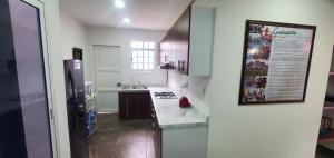 Η κουζίνα ή μικρή κουζίνα στο Hostal Guelaguetza Danza de la Pluma con Baño Propio