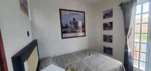 Ένα ή περισσότερα κρεβάτια σε δωμάτιο στο Hostal Guelaguetza Baño Compartido