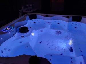 a jacuzzi tub with lights in a room at Solar da Cavalariça in Ourique