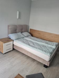Postel nebo postele na pokoji v ubytování DOM GOŚCINNY ANNA