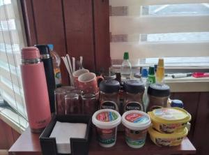 a counter with jars of peanut butter and other condiments at Hospedaje y alojamiento Valencia in Puerto Montt