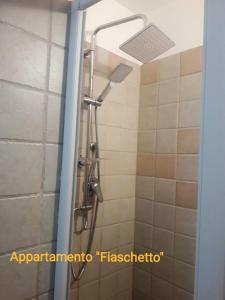 a shower with a shower head in a bathroom at Ramasole in Ostuni +65 photos