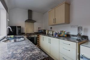 a kitchen with a sink and a counter top at Number Sixteen in Bishop Auckland