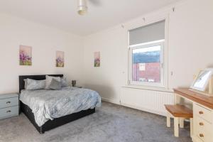 a bedroom with a bed and a window at Number Sixteen in Bishop Auckland