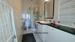 Ein Badezimmer in der Unterkunft Apartament Gdańska 104/62