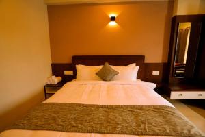 Zubis Inn Hotel客房内的一张或多张床位