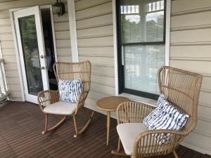 two chairs and a table on a porch at The 1425 Inn in Columbia