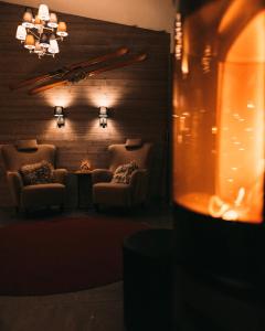 a waiting room with chairs and a chandelier at Abisko Mountain Lodge in Abisko