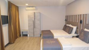 Cama ou camas em um quarto em ByAKKAN HOTEL