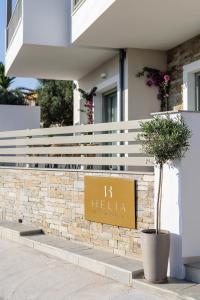 a sign that says h helena in front of a building at Helia All Seasons Apartments in Astris