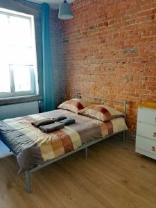 A bed or beds in a room at Centrum Przy Promenadzie