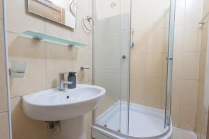a bathroom with a sink and a glass shower at MUSE No 1 in Marmaris +18 photos