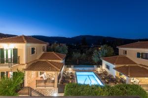 an aerial view of a villa with a swimming pool at Kookis Village in Keri