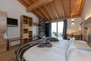 Postel nebo postele na pokoji v ubytování Berghotel Tgantieni