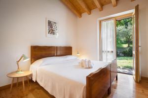 Posteľ alebo postele v izbe v ubytovaní Casa del Bosco