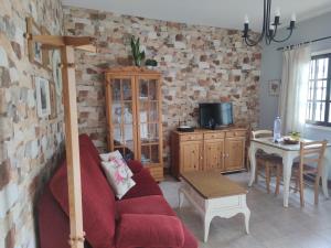 Telewizja i/lub zestaw kina domowego w obiekcie Casas Rurales El Serrillal