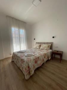 A bed or beds in a room at Adil Pansiyon