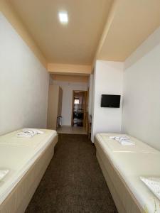Postel nebo postele na pokoji v ubytování Hotel Ami - M