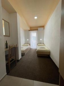 Postel nebo postele na pokoji v ubytování Hotel Ami - M