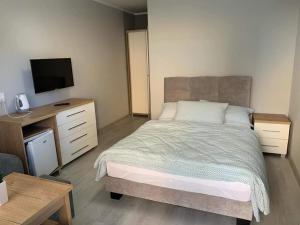 Postel nebo postele na pokoji v ubytování DOM GOŚCINNY ANNA