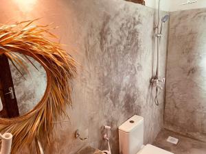 Ein Badezimmer in der Unterkunft Babalao Bungalows